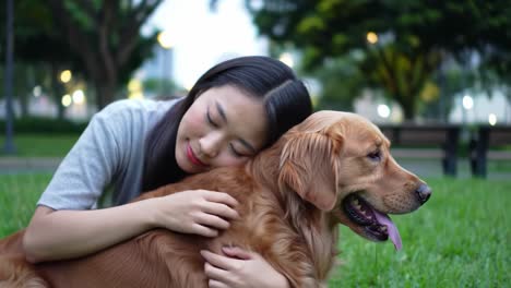 a heartwarming bond: a young woman embraces her beloved golden retriever in a serene park setting, celebrating the joy of friendship and loyalty