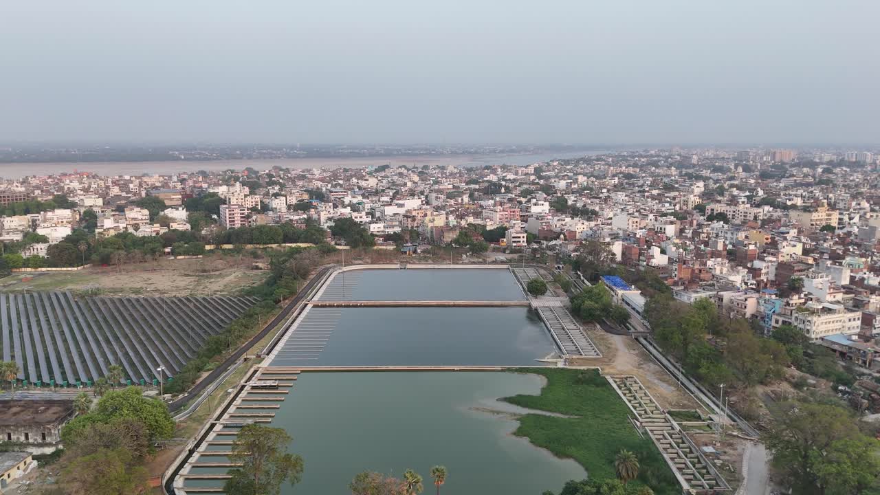 Overhead footage of an expansive solar power plant with neatly aligned solar panels