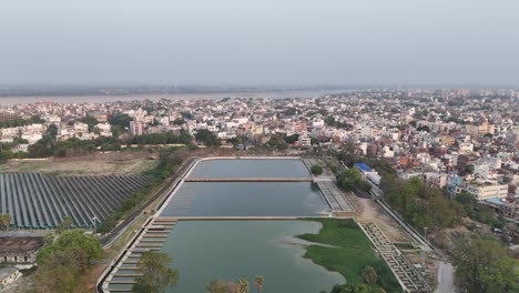 overhead footage of an expansive solar power plant with neatly aligned solar panels