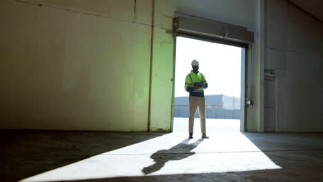warehouse worker standing in doorway