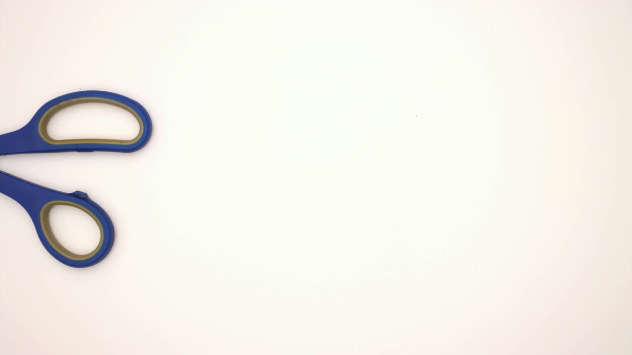 Scissors on white background - Stop motion animation