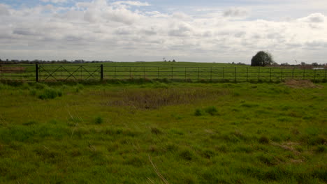 extra wide shot from st benet’s abbey 16th century gatehouse with 18th century windmill