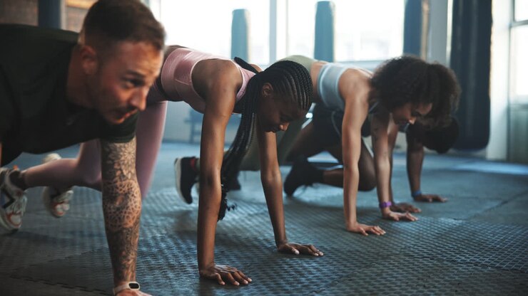 Fitness, gym and moving people in a class