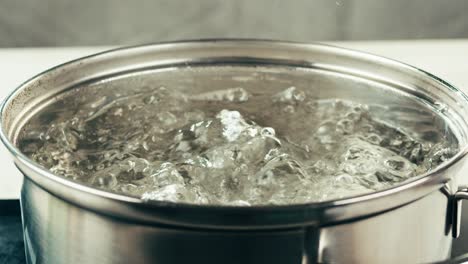 boiling water in a metal pot