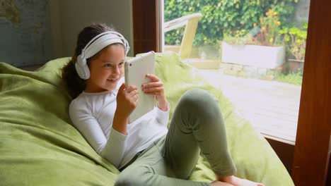 girl using digital tablet at home 4k