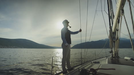 captain on a yacht at sunset