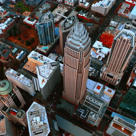 drone footage high above the stunning skyscrapers of charlotte, north carolina, usa. approaching the tops of high-rise buildings in city downtown.