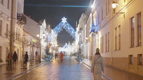 christmas decorated european city street at night