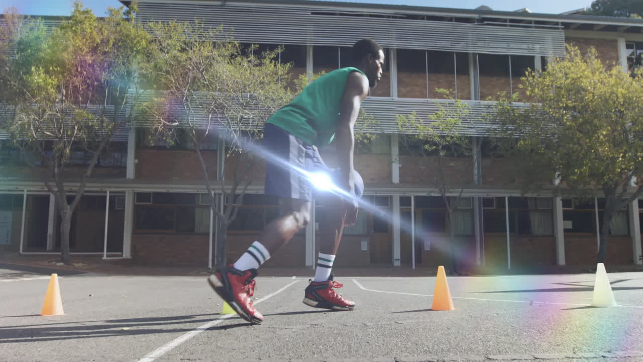 Male athlete practicing basketball dribbling outdoors for health, featuring animated speed icons