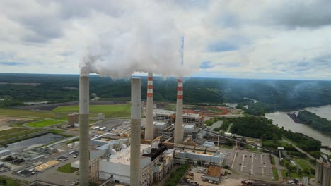 aerial orbit of smokestacks at a fossil plant, located on the cumberland river in tennessee