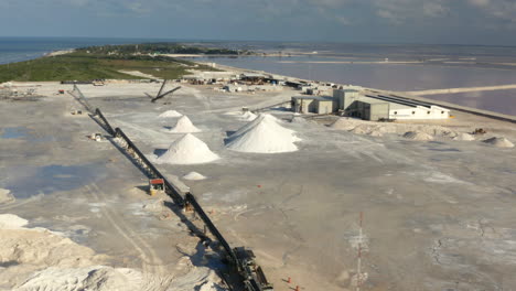 Coastal-saltern-with-mounds-of-dried-salt-and-saltworks-in-Yucatan