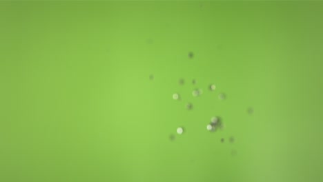 flying of green apple in green background in slow motion
