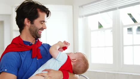 -Handsome-father-playing-with-his-baby