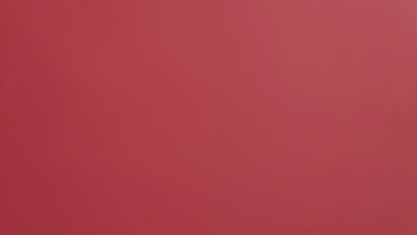 rice falling on a red background