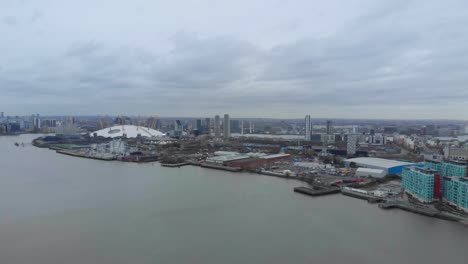 stable drone shot of o2 arena london on a cloudy day