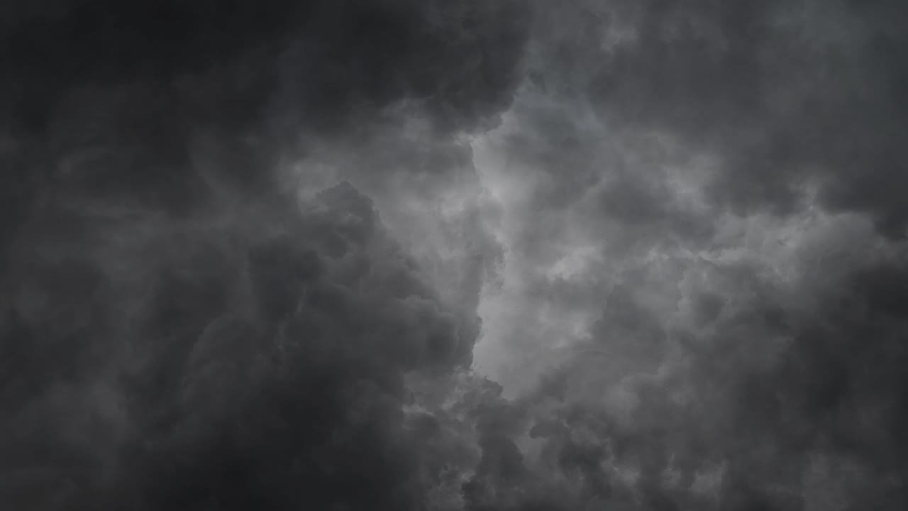 thick cumulus clouds in the dark sky