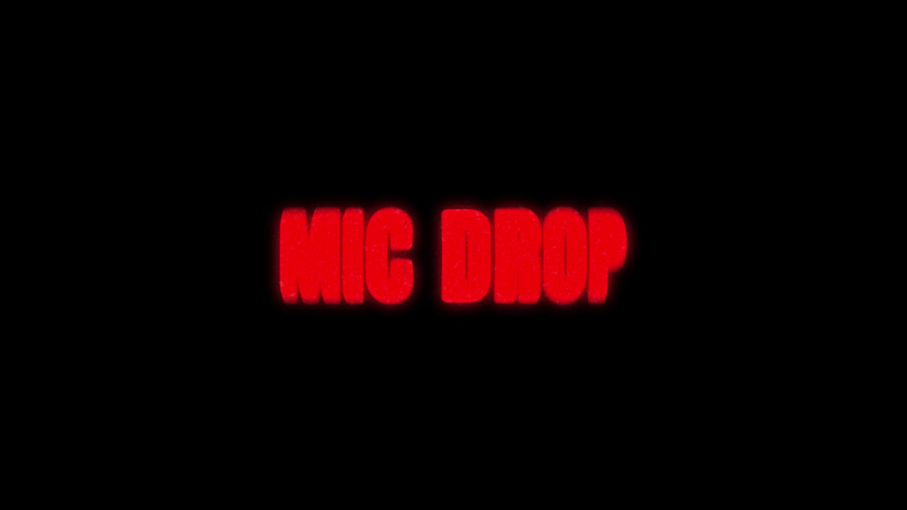 Red Glowing Mic Drop Text Animation on Black Background
