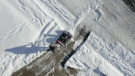 aerial top view of man sbow blowing with camera spin