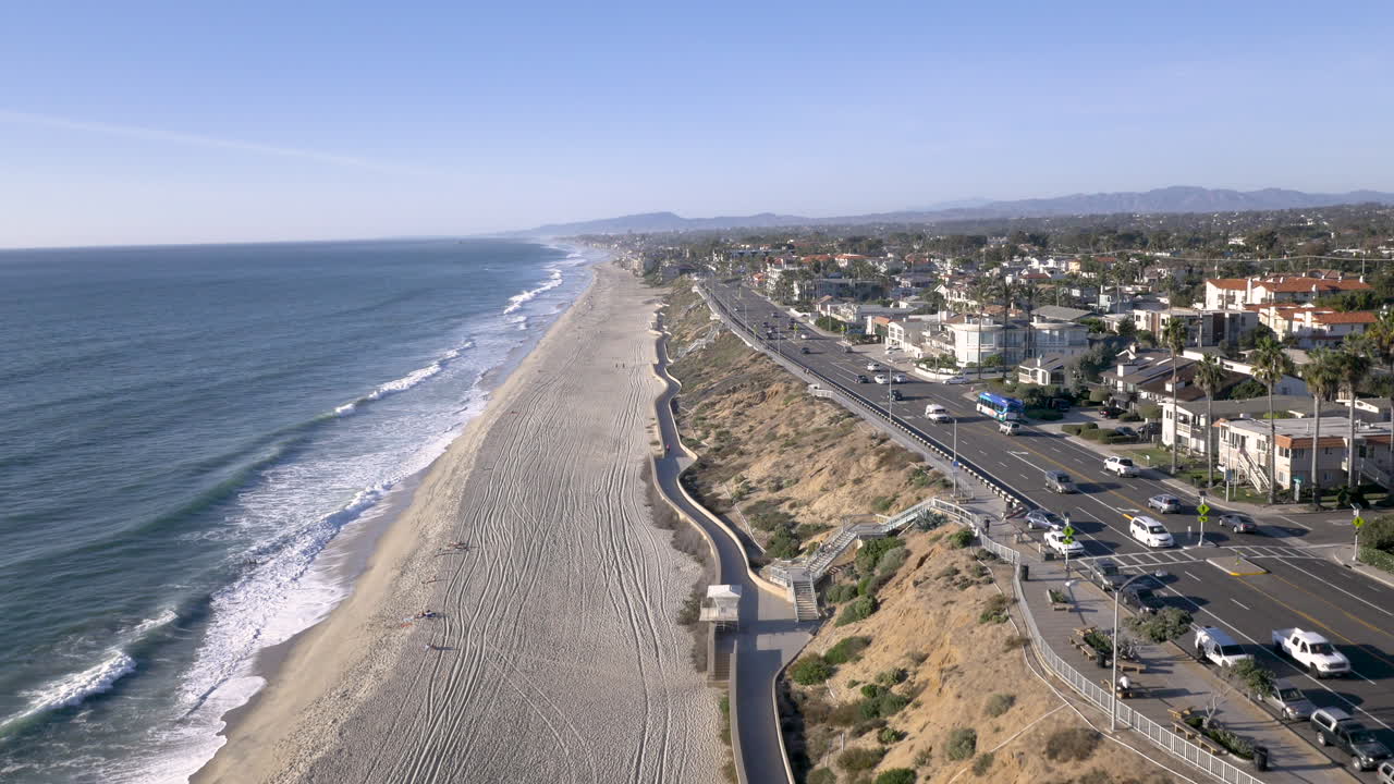 Aerial View of Sunny Coastal Highway and Beach