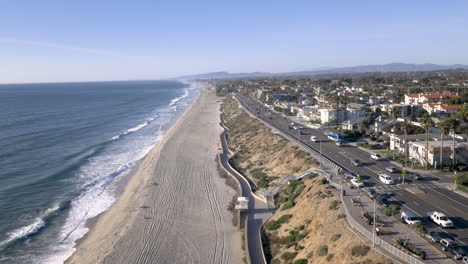 aerial view of sunny coastal highway and beach