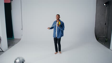 man holding sunflower in studio