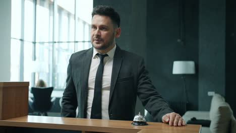 hotel receptionist welcoming guests