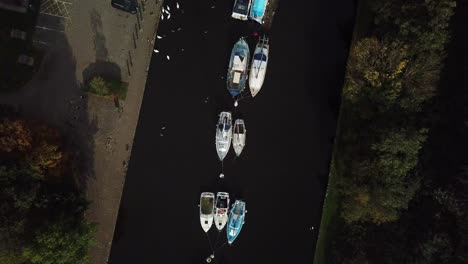 high fly over sail boats parked on canal