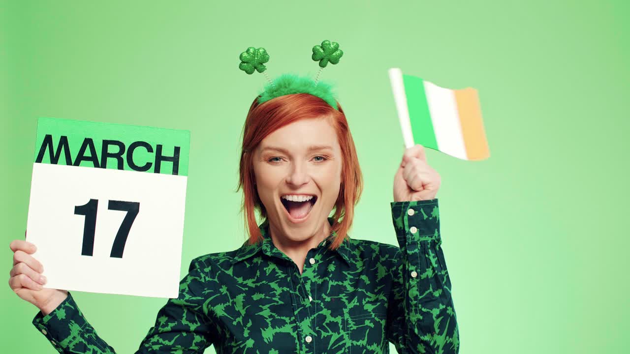 Woman with Irish flag celebrating Saint Patrick's Day