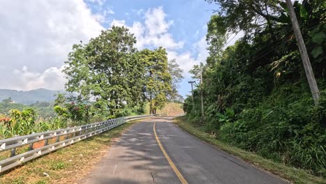 traveling down a winding road surrounded by nature