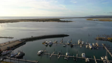 fishing boats moored on peaceful river of bandon harbor in the city of bandon, oregon, united states