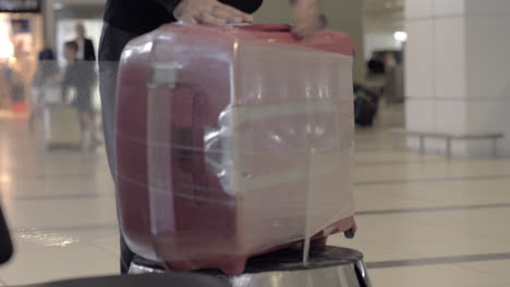 wrapping baggage at the airport