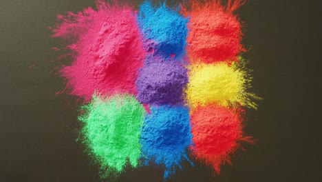 video of multi coloured powders with copy space on black background