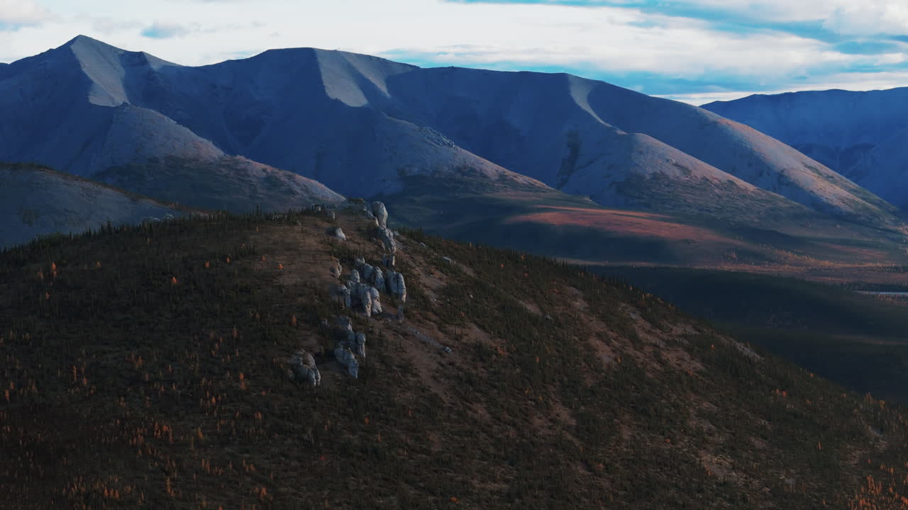 Churchward Hill And Ogilvie Mountain Range In Autumn Colors From The Dempster Highway In Yukon, Canada. Aerial Shot