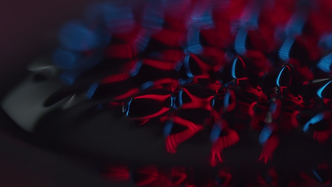 fluid forming spikes in a dark abstract atmosphere