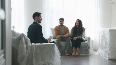 real estate agent discussing property with couple