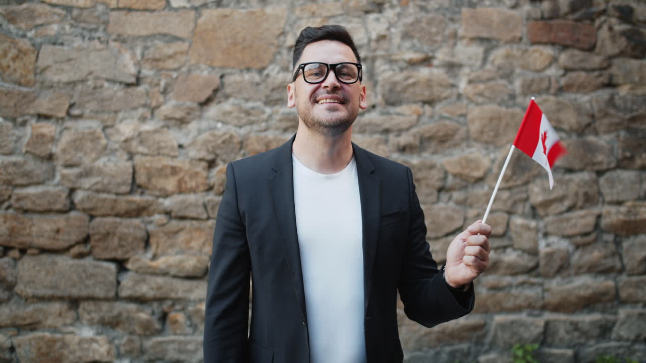 Man holding Canadian flag