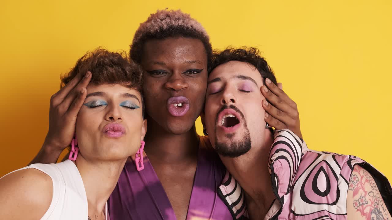 Multiracial transgender people smiling at the camera together