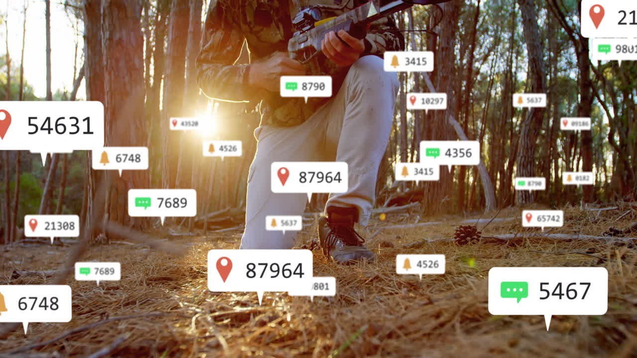 Mature adult male kneeling in pine forest, interacting with floating tech social media alerts