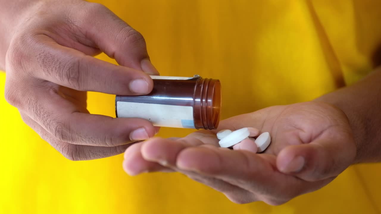Person taking pills