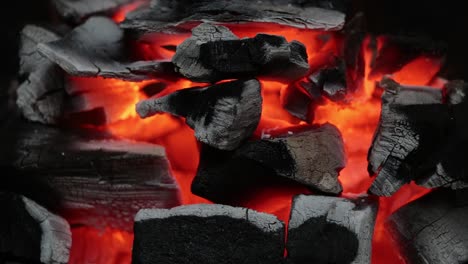 glowing embers of charcoal briquettes