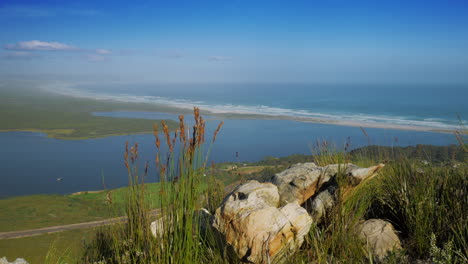 panoramic view from vantage point on mountain of lagoon and pristine coastline with white beach, hermanus, south africa