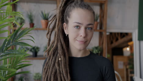 woman with dreadlocks in a cafe
