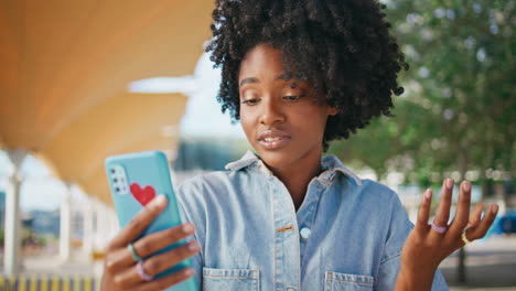 young woman taking a selfie in a park