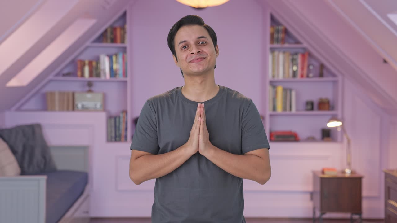 Happy Indian man doing Namaste and greetings