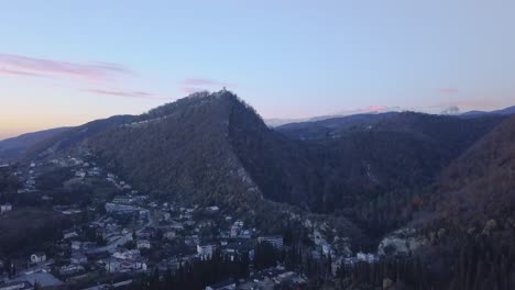 mountainous town at sunset/sunrise