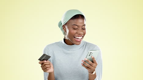 cellphone, credit card and black woman in a studio