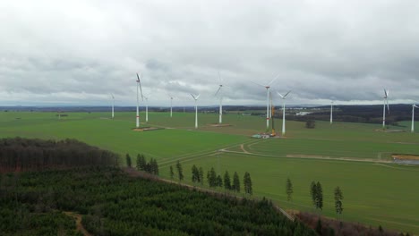 Creating-a-Better-Tomorrow:-Construction-of-Wind-Turbine-with-Crane-Assistance-on-a-Cloudy-Day-in-North-Rhine-Westphalia,-Germany