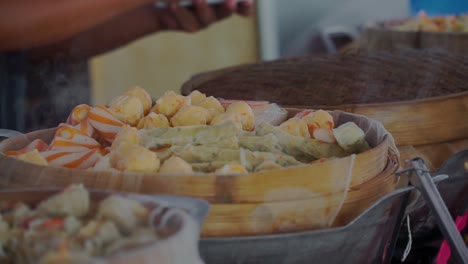 close up shot of vendor selling fresh cantonese dim sum food on street market