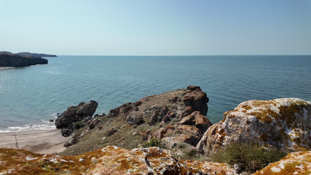 Serene Seascape: Rocky Coastline and Calm Ocean