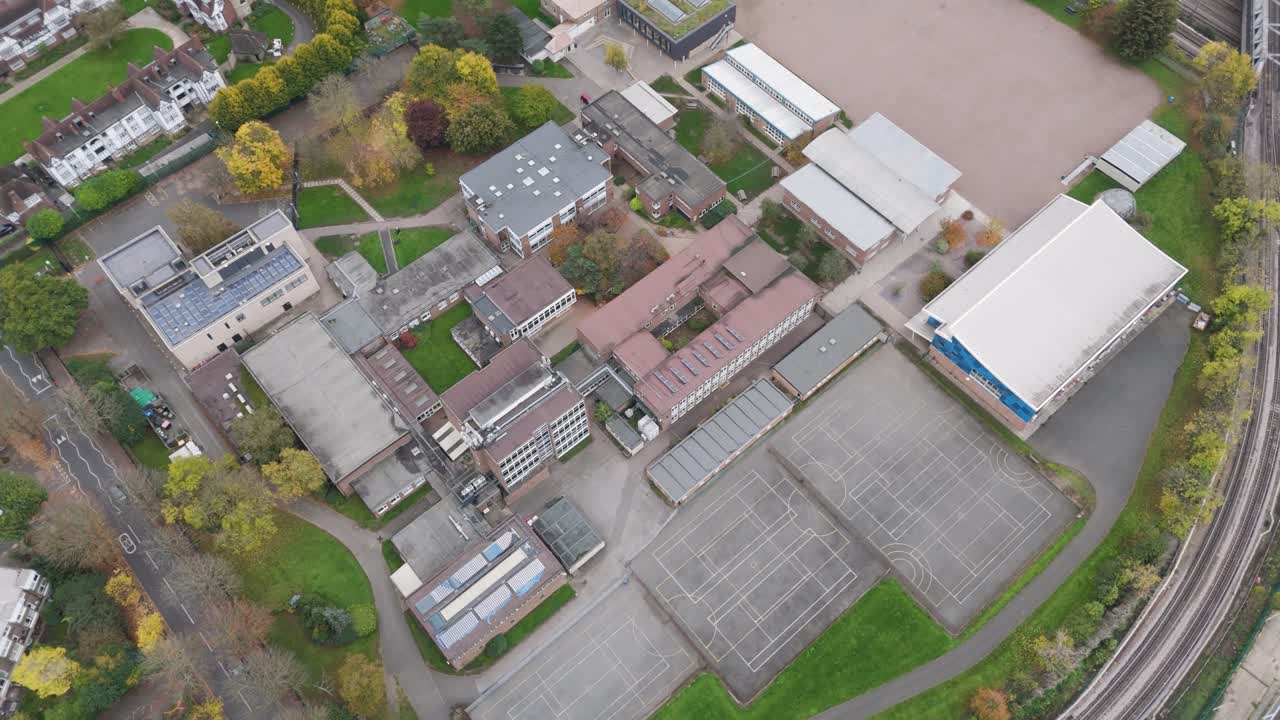 Aerial view capturing Ellen Wilkinson School's campus layout with educational facilities and outdoor spaces, Ealing, London, UK, October 2024
